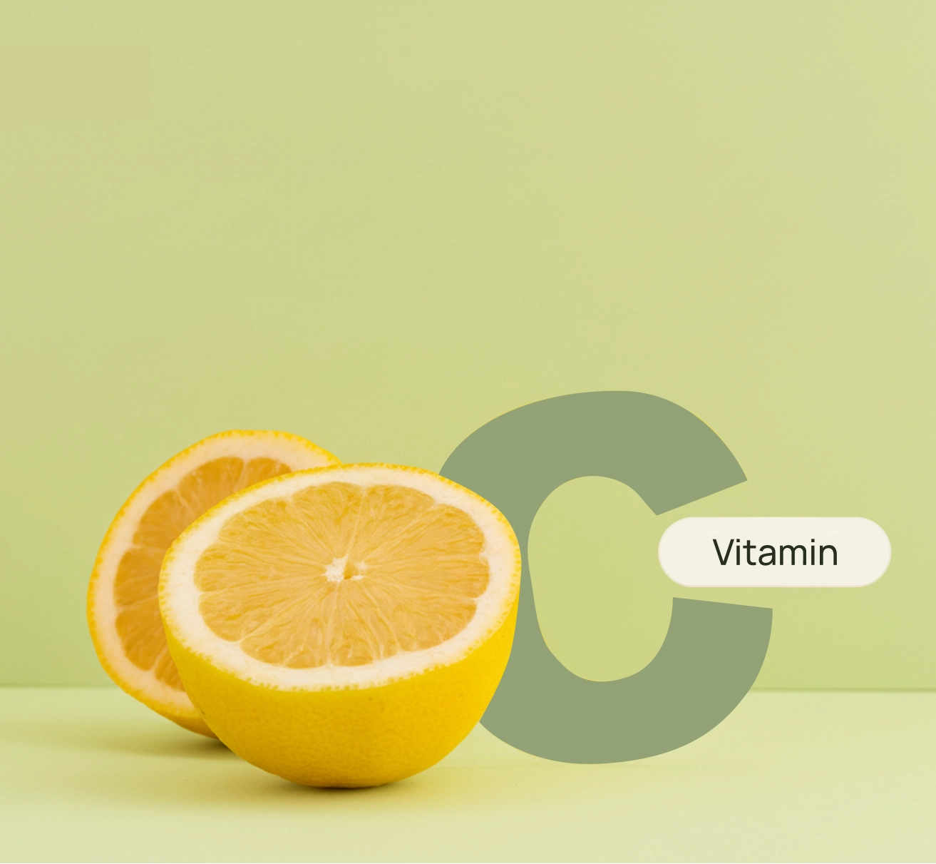Lemon halves beside a large letter C and a vitamin label on a light green background.