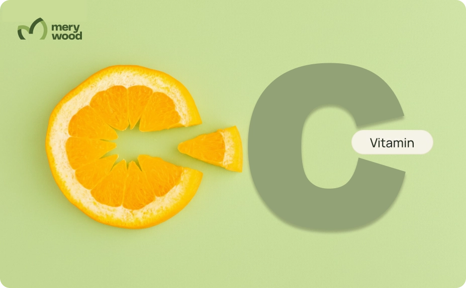 Orange slice with a missing wedge beside a large letter C and a vitamin label.