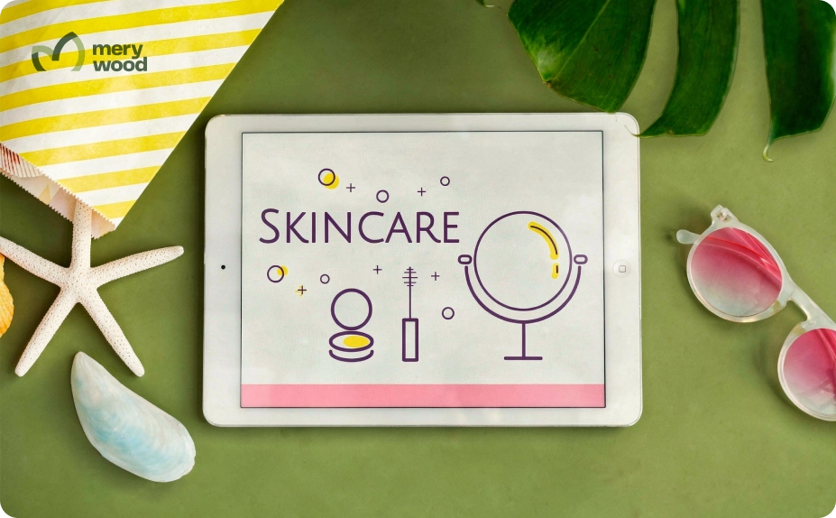Tablet displaying skincare concept with mirror and makeup icons surrounded by tropical leaves and summer accessories